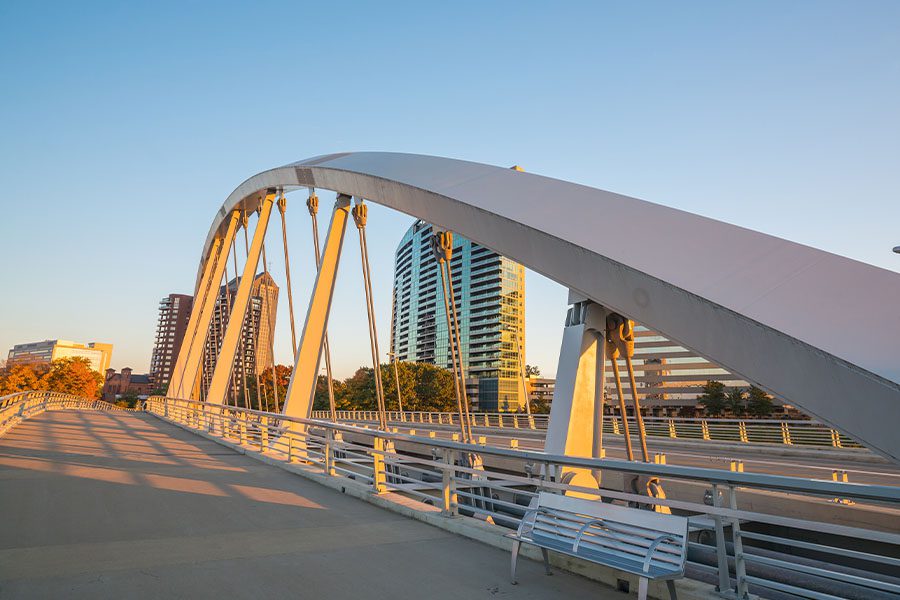 About Our Agency - Abstract View of Downtown Columbus, Ohio From Across a Bridge at Sunset